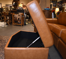 Load image into Gallery viewer, Conversational Curve all leather collection cognac or black. Storage ottoman