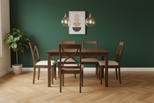 Load image into Gallery viewer, Ebbe 40 inch square solid wood dining table and 4 chairs styled in a warm dining room with deep forest green walls
