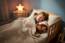 Load image into Gallery viewer, Toddler peacefully sleeping in a cozy toddler bed cuddled with Baby Zoofari Bed Buddy Bear long plush pillow

