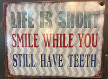 Load image into Gallery viewer, Life Is Too Short – Smile While You Still Have Teeth Funny Metal Wall Sign | Amazing Indoors
